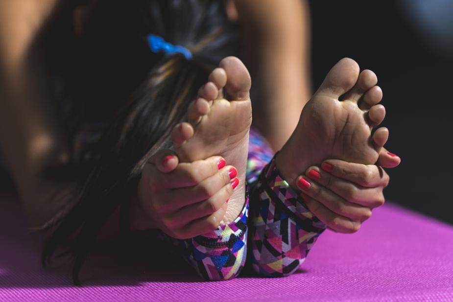 yoga-forward-fold-feet_925x